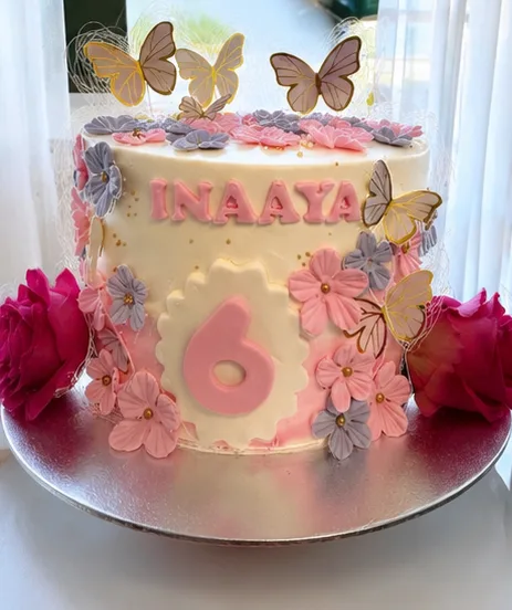 A custom butterfly and floral birthday cake